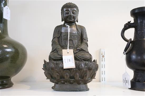 A Chinese bronze seated figure of Buddha Shakyamuni, 17th century, H. 32cm